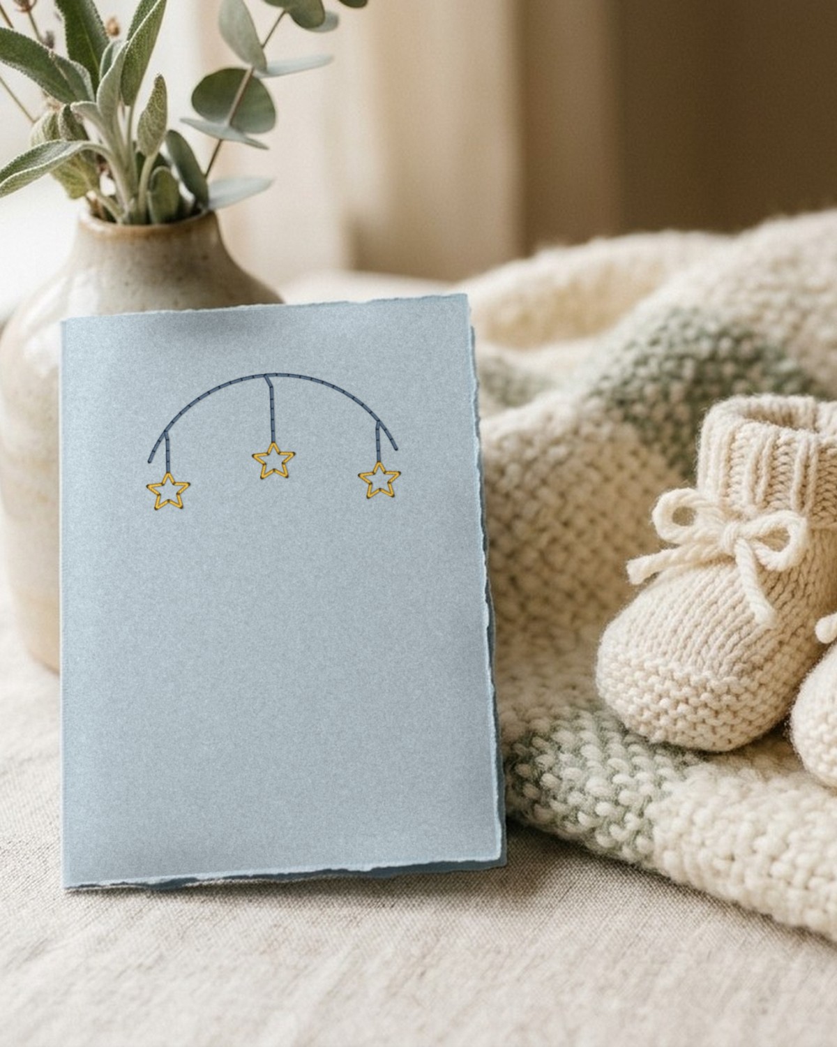 Stitched star mobile on a pale blue card